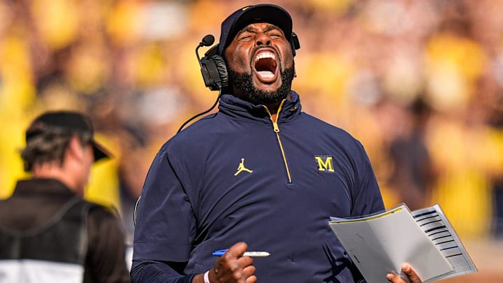 Michigan head coach Sherrone Moore cheers on before a play against Washington during the first half at Michigan Stadium in Ann Arbor on Saturday, Oct. 18, 2025.