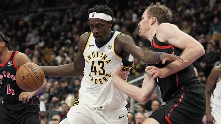 Dec 3, 2024; Toronto, Ontario, CAN; Indiana Pacers forward Pascal Siakam (43) drives to the net against Toronto Raptors center Jakob Poeltl (19) during the second half at Scotiabank Arena. Mandatory Credit: John E. Sokolowski-Imagn Images