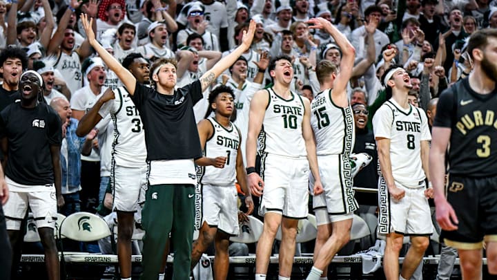 Michigan State's bench celebrates after Coen Carr's dunk against Purdue during the second half on Tuesday, Feb. 18, 2025, at the Breslin Center in East Lansing.