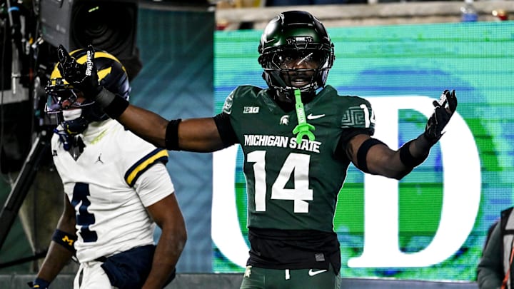 Michigan State's Malcolm Bell, right, reacts after getting called for pass interference against Michigan's Andrew Marsh during the first quarter on Saturday, Oct. 25, 2025, at Spartan Stadium in East Lansing.