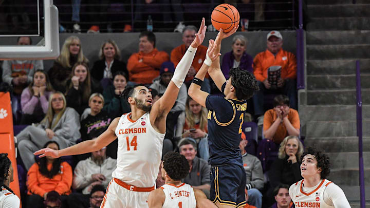Clemson center Christian Reeves (14) defends a shot by University of California guard Andrej Stojankovic (2) during the first half at Littlejohn Coliseum Saturday, Jan 4, 2024 in Clemson, S.C.