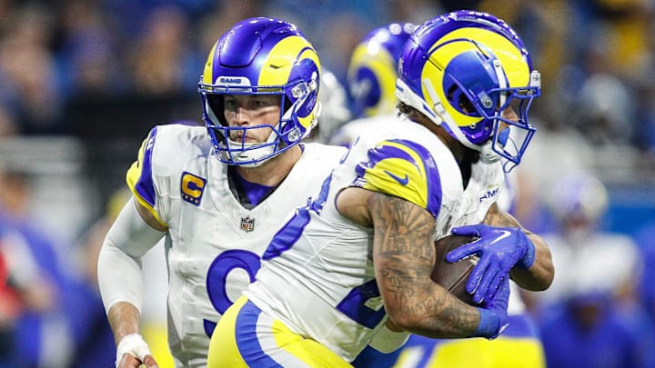 L.A. Rams quarterback Matthew Stafford (9) hands the ball to running back Kyren Williams (23) against the Detroit Lions during the second half of the NFL wild-card playoff game at Ford Field in Detroit on Sunday, Jan, 14, 2024.