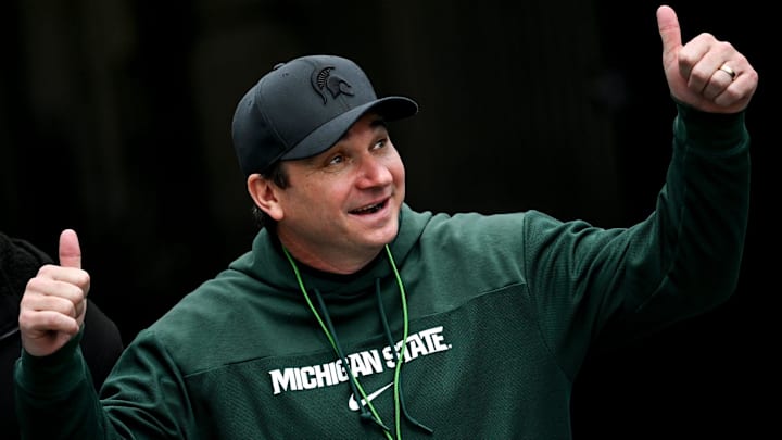 Michigan State's head coach Jonathan Smith gives a thumbs up to the crowd as he enters the field during the football Spring Showcase on Saturday, April 20, 2024, at Spartan Stadium in East Lansing.