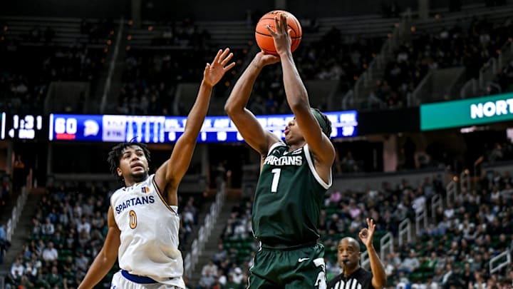 Michigan State's Jeremy Fears Jr., right, makes a 3-pointer as San Jose State's Colby Garland defends during the second half on Thursday, Nov. 13, 2025, at the Breslin Center in East Lansing.