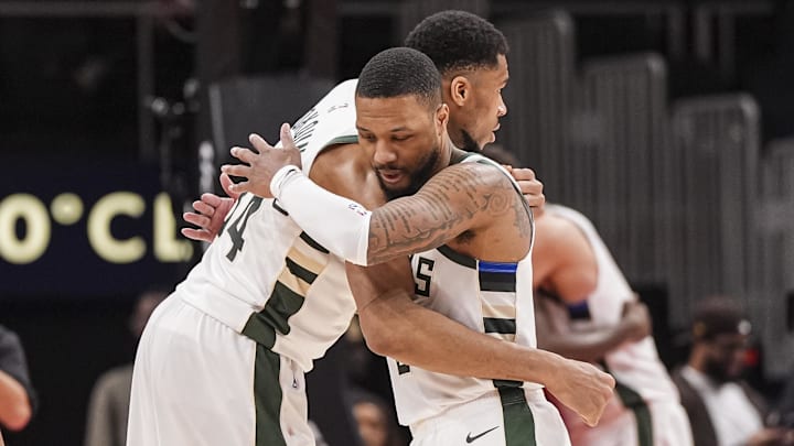 Mar 4, 2025; Atlanta, Georgia, USA: Milwaukee Bucks forward Giannis Antetokounmpo (34) and guard Damian Lillard (0) react after defeating the Atlanta Hawks at State Farm Arena. Mandatory Credit: Dale Zanine-Imagn Images