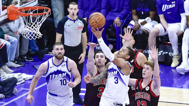 Nov 16, 2025; Salt Lake City, Utah, USA; Utah Jazz guard Keyonte George (3) makes a layup around Chicago Bulls guard/forward Kevin Huerter (13) during the second half at Delta Center. Mandatory Credit: Peter Creveling-Imagn Images Nov 16, 2025; Salt Lake City, Utah, USA; Utah Jazz guard Keyonte George (3) makes a layup around Chicago Bulls guard/forward Kevin Huerter (13) during the second half at Delta Center. Mandatory Credit: Peter Creveling-Imagn Images