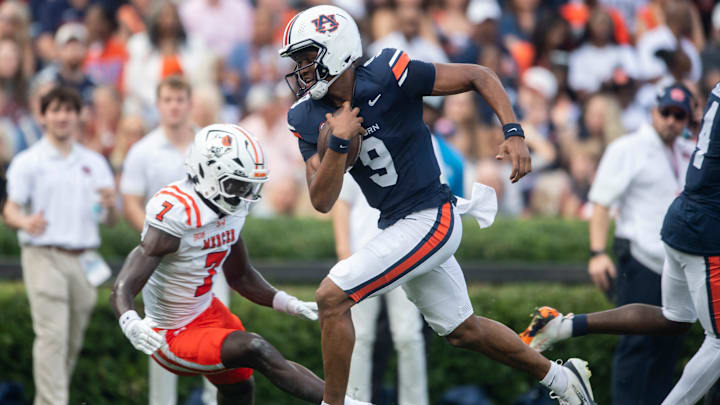 Auburn Tigers quarterback Deuce Knight (9) runs the ball into the end zone for a touchdown as Auburn Tigers take on Mercer Bears at Jordan-Hare Stadium in Auburn, Ala. on Saturday, Nov. 22, 2025. Auburn Tigers lead the Mercer Bears 35-17 at halftime.