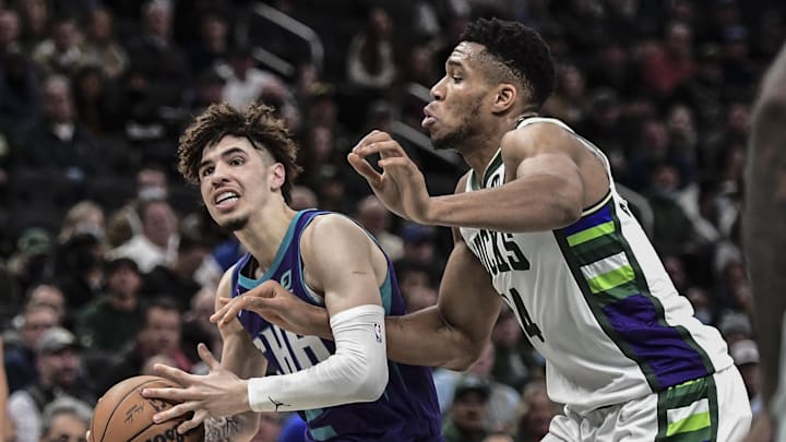 Dec 1, 2021; Milwaukee, Wisconsin, USA; Charlotte Hornets guard LaMelo Ball (2) drives for the basket against Milwaukee Bucks forward Giannis Antetokounmpo (34) in the second quarter at Fiserv Forum. Mandatory Credit: Benny Sieu-Imagn Images