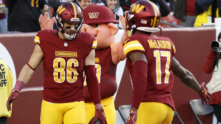 Nov 24, 2024; Landover, Maryland, USA; Washington Commanders tight end Zach Ertz (86) celebrates with Commanders wide receiver Terry McLaurin (17) after catching a touchdown pass against the Dallas Cowboys at Northwest Stadium. Mandatory Credit: Geoff Burke-Imagn Images