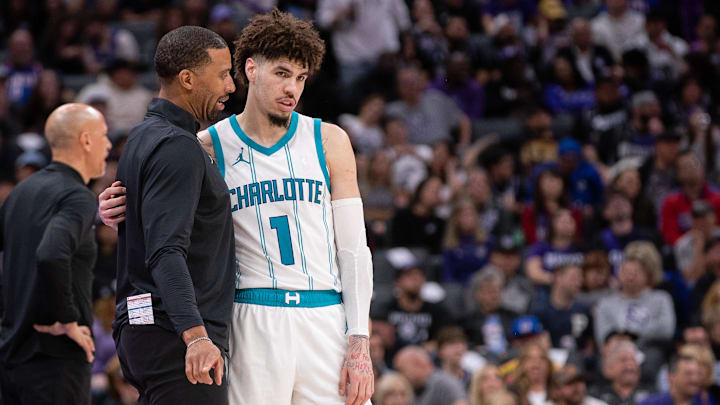Feb 24, 2025; Sacramento, California, USA; Charlotte Hornets head coach Charles Lee talks with guard LaMelo Ball (1) during a time out in the fourth quarter of the game against the Sacramento Kings at Golden 1 Center. Mandatory Credit: Ed Szczepanski-Imagn Images