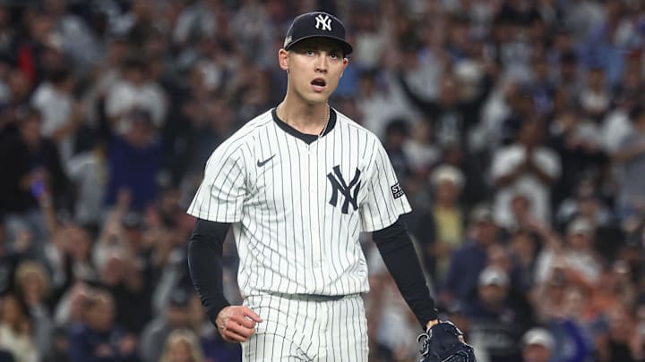 Oct 5, 2024; Bronx, New York, USA; New York Yankees pitcher Luke Weaver (30) reacts after recording a strike out during the ninth inning against the Kansas City Royals during game one of the ALDS for the 2024 MLB Playoffs at Yankee Stadium. Mandatory Credit: Vincent Carchietta-Imagn Images