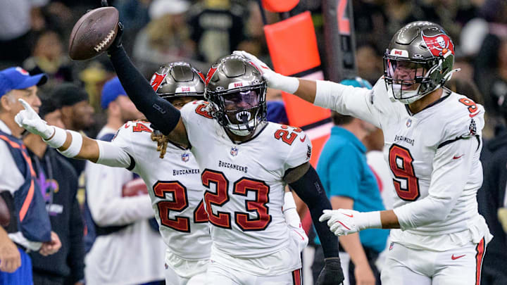 Oct 13, 2024; New Orleans, Louisiana, USA; Tampa Bay Buccaneers safety Tykee Smith (23) celebrates an interception of a ball intended for New Orleans Saints wide receiver Rashid Shaheed (22) with cornerback Tyrek Funderburk (24) and linebacker Joe Tryon-Shoyinka (9) during the fourth quarter at Caesars Superdome. Mandatory Credit: Matthew Hinton-Imagn Images Oct 13, 2024; New Orleans, Louisiana, USA; Tampa Bay Buccaneers safety Tykee Smith (23) celebrates an interception of a ball intended for New Orleans Saints wide receiver Rashid Shaheed (22) with cornerback Tyrek Funderburk (24) and linebacker Joe Tryon-Shoyinka (9) during the fourth quarter at Caesars Superdome. Mandatory Credit: Matthew Hinton-Imagn Images