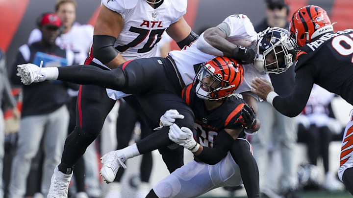 Oct 23, 2022; Cincinnati, Ohio, USA; Cincinnati Bengals safety Jessie Bates III (30) stops a run by Atlanta Falcons tight end Kyle Pitts (8) in the first half at Paycor Stadium. Mandatory Credit: Katie Stratman-Imagn Images