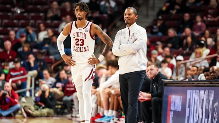 Dec 7, 2024; Columbia, South Carolina, USA; South Carolina Gamecocks head coach Lamont Paris speaks with South Carolina Gamecocks guard Cam Scott (23) against the East Carolina Pirates in the second half at Colonial Life Arena. Mandatory Credit: Jeff Blake-Imagn Images