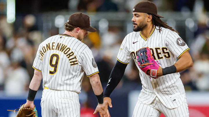 Apr 14, 2026; San Diego, California, USA; San Diego Padres right fielder Fernando Tatis Jr. (23) celebrates with second baseman Jake Cronenworth (9) after defeating the Seattle Mariners at Petco Park. Mandatory Credit: David Frerker-Imagn Images