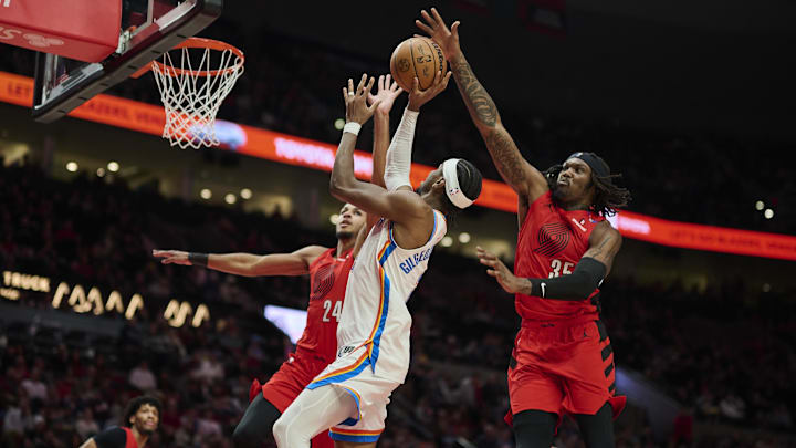 Jan 26, 2025; Portland, Oregon, USA; Portland Trail Blazers center Robert Williams III (35) blocks a shot during the second half against Oklahoma City Thunder guard Shai Gilgeous-Alexander (2) at Moda Center. Mandatory Credit: Troy Wayrynen-Imagn Images