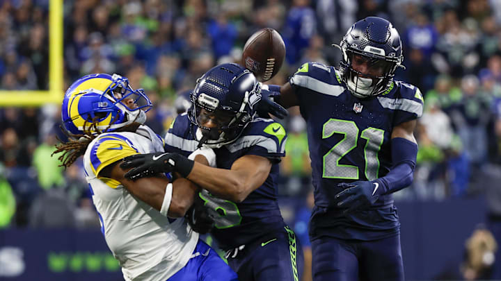Nov 3, 2024; Seattle, Washington, USA; Seattle Seahawks cornerback Coby Bryant (8) breaks up a pass intended for Los Angeles Rams wide receiver Demarcus Robinson (15) during the fourth quarter at Lumen Field. Seattle Seahawks cornerback Devon Witherspoon (21) follows the play at right. Nov 3, 2024; Seattle, Washington, USA; Seattle Seahawks cornerback Coby Bryant (8) breaks up a pass intended for Los Angeles Rams wide receiver Demarcus Robinson (15) during the fourth quarter at Lumen Field. Seattle Seahawks cornerback Devon Witherspoon (21) follows the play at right.