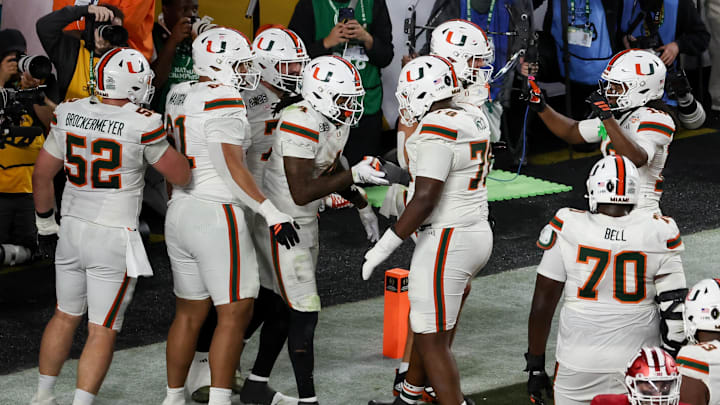 Jan 19, 2026; Miami Gardens, FL, USA; Miami Hurricanes running back Mark Fletcher Jr. (4) celebrates with teammates after scoring a touchdown against the Indiana Hoosiers in the fourth quarter during the College Football Playoff National Championship game at Hard Rock Stadium. Mandatory Credit: Kim Klement Neitzel-Imagn Images