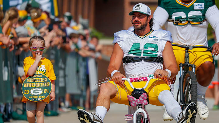 Green Bay Packers long snapper Matt Orzech (42) rides a young fan’s bicycle to practice in the DreamDrive before the eighth practice of training camp on Wednesday, July 31, 2024, at Lambeau Field in Green Bay, Wis.
Tork Mason/USA TODAY NETWORK-Wisconsin