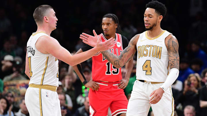 Jan 5, 2026; Boston, Massachusetts, USA; Boston Celtics guard Payton Pritchard (11) congratulates guard Anfernee Simons (4) after a basket during the second half against the Chicago Bulls at TD Garden. Mandatory Credit: Bob DeChiara-Imagn Images