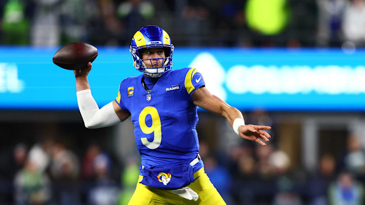 Dec 18, 2025; Seattle, Washington, USA; Los Angeles Rams quarterback Matthew Stafford (9) passes against the Seattle Seahawks in the first half at Lumen Field. Mandatory Credit: Kevin Ng-Imagn Images