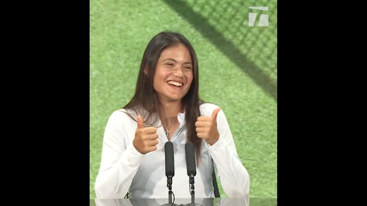 Raducanu laughs during a press conference ahead of Wimbledon