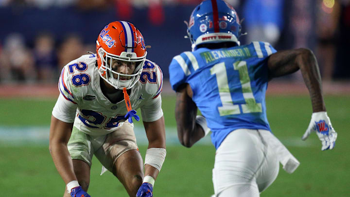Nov 15, 2025; Oxford, Mississippi, USA; Florida Gators defensive back Devin Moore (28) defends in coverage Mississippi Rebels wide receiver Deuce Alexander (11) during the third quarter at Vaught-Hemingway Stadium. Mandatory Credit: Petre Thomas-Imagn Images