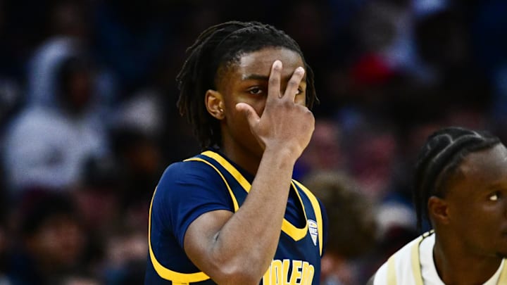 Mar 14, 2026; Cleveland, OH, USA; Toledo Rockets guard Leroy Blyden Jr. (2) celebrates after hitting a three point basket against the Akron Zips during the first half of the men’s Mid-American Conference Championship at Rocket Arena.