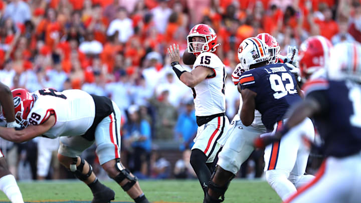 Sep 30, 2023; Auburn, Alabama, USA;  Georgia Bulldogs quarterback Carson Beck (15) looks for a receiver during the fourth quarter against the Auburn Tigers at Jordan-Hare Stadium. Mandatory Credit: John Reed-Imagn Images