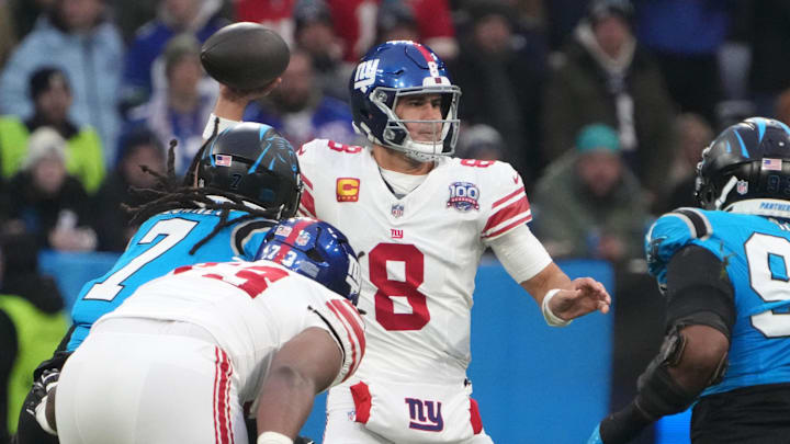 Nov 10, 2024; Munich, Germany; New York Giants quarterback Daniel Jones (8) throws the ball against the Carolina Panthers in the first half during the 2024 NFL Munich Game at Allianz Arena. Mandatory Credit: Kirby Lee-Imagn Images