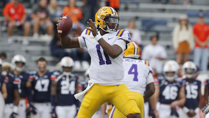 Oct 31, 2020; Auburn, Alabama, USA;  LSU Tigers quarterback TJ Finley (11) drops back to pass against the Auburn Tigers during the first quarter at Jordan-Hare Stadium. Mandatory Credit: John Reed-Imagn Images