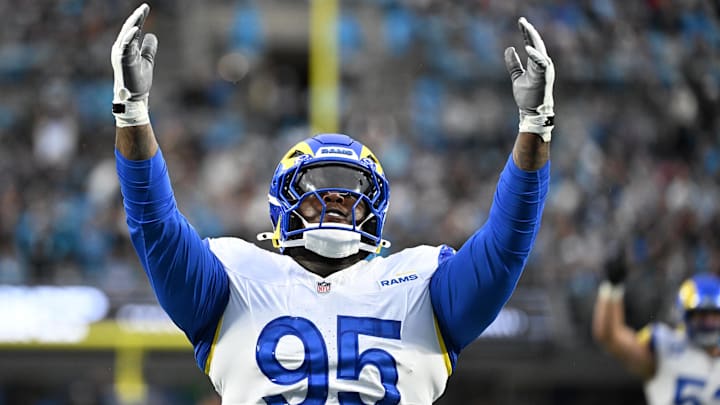 Jan 10, 2026; Charlotte, NC, USA; Los Angeles Rams defensive tackle Poona Ford (95) reacts after a sack against the Carolina Panthers in the first half during the NFC Wild Card Round game at Bank of America Stadium. Mandatory Credit: Bob Donnan-Imagn Images