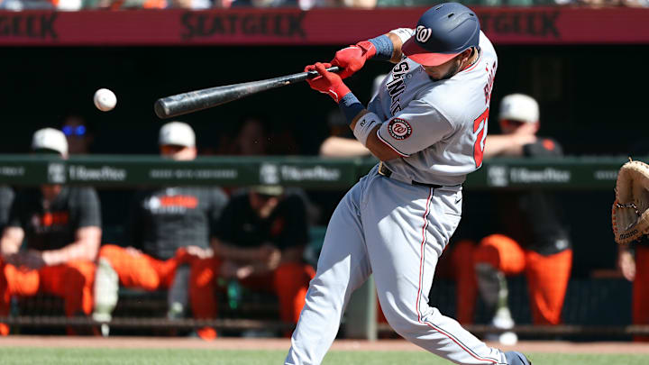 May 17, 2025; Baltimore, Maryland, USA; Washington Nationals catcher Keibert Ruiz (20) hits an RBI single during the first inning against the Baltimore Orioles at Oriole Park at Camden Yards.