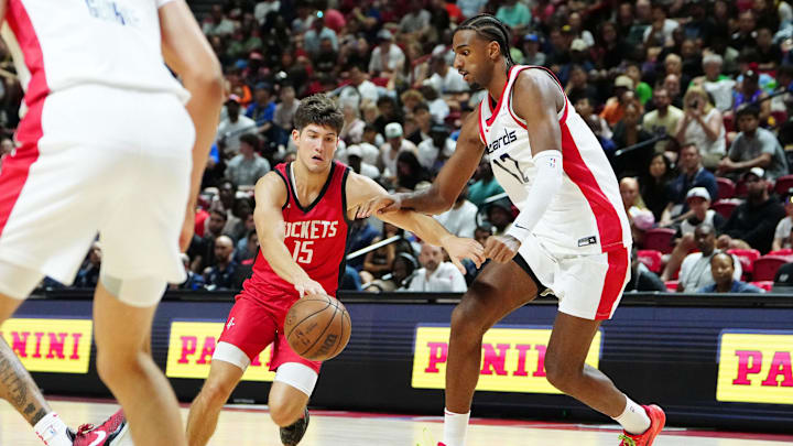 Jul 14, 2024; Las Vegas, NV, USA; Houston Rockets guard Reed Sheppard (15) dribbles against Washington Wizards forward Alex Sarr (12) during the fourth quarter at Thomas & Mack Center. Mandatory Credit: Stephen R. Sylvanie-Imagn Images Jul 14, 2024; Las Vegas, NV, USA; Houston Rockets guard Reed Sheppard (15) dribbles against Washington Wizards forward Alex Sarr (12) during the fourth quarter at Thomas & Mack Center. Mandatory Credit: Stephen R. Sylvanie-Imagn Images