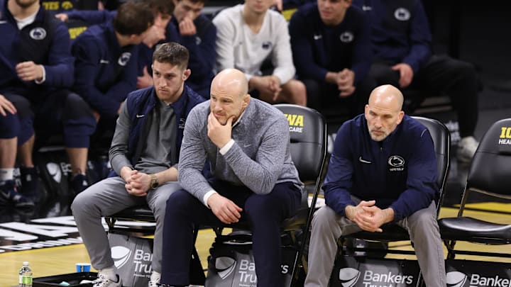 Penn State Nittany Lions wrestling coach Cael Sanderson (center) watches his team wrestle the Iowa Hawkeyes at Carver-Hawkeye Arena. 