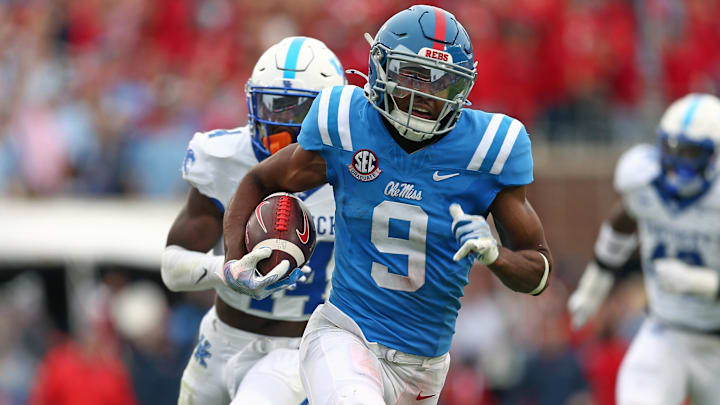 Sep 28, 2024; Oxford, Mississippi, USA; Mississippi Rebels wide receiver Tre Harris (9) runs after a catch for a first down as Kentucky Wildcats defensive back Jordan Lovett (25) pursues during the second half at Vaught-Hemingway Stadium. Sep 28, 2024; Oxford, Mississippi, USA; Mississippi Rebels wide receiver Tre Harris (9) runs after a catch for a first down as Kentucky Wildcats defensive back Jordan Lovett (25) pursues during the second half at Vaught-Hemingway Stadium.