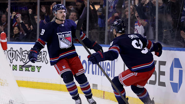 New York Rangers center Sam Carrick (39) celebrates his game winning goal against the New Jersey Devils. Mandatory Credit: Brad Penner-Imagn Images
