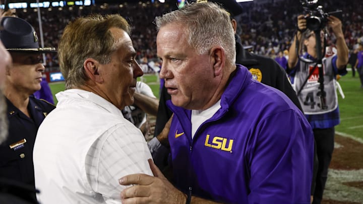 Nov 4, 2023; Tuscaloosa, Alabama, USA; Alabama Crimson Tide head coach Nick Saban talks with LSU Tigers head coach Brian Kelly after the second half at Bryant-Denny Stadium. Mandatory Credit: Butch Dill-Imagn Images