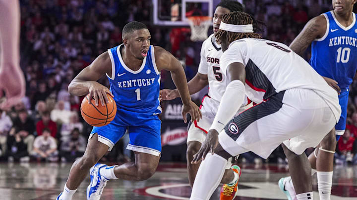 Jan 7, 2025; Athens, Georgia, USA; Kentucky Wildcats guard Lamont Butler (1) dribbles against the Georgia Bulldogs during the second half at Stegeman Coliseum. Mandatory Credit: Dale Zanine-Imagn Images Jan 7, 2025; Athens, Georgia, USA; Kentucky Wildcats guard Lamont Butler (1) dribbles against the Georgia Bulldogs during the second half at Stegeman Coliseum. Mandatory Credit: Dale Zanine-Imagn Images