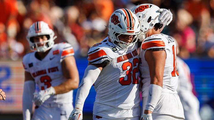 Oklahoma State Cowboys linebacker Ethan Wesloski puts his arm around a teammate. Oklahoma State Cowboys linebacker Ethan Wesloski puts his arm around a teammate.
