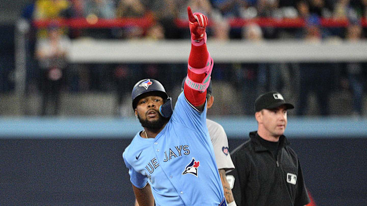 Sep 24, 2024; Toronto, Ontario, CAN; Toronto Blue Jays designated hitter Vladimir Guerrero Jr. (27) reacts after hitting a two run RBI double against the Boston Red Sox in the third inning at Rogers Centre.