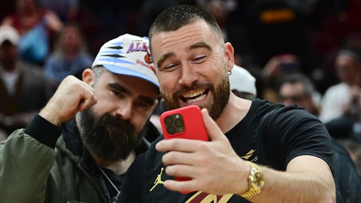 Cleveland natives and NFL players Travis, right, and Jason Kelce celebrate after the Cleveland Cavaliers beat the Boston Celtics during the second half at Rocket Mortgage FieldHouse.