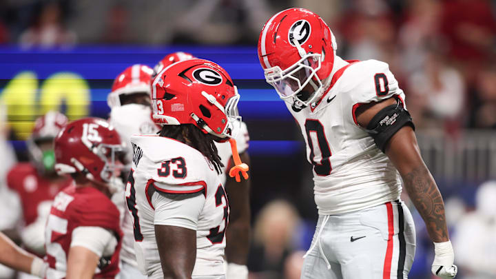 Dec 6, 2025; Atlanta, GA, USA; Georgia Bulldogs linebacker Gabe Harris Jr. (0) celebrates with Georgia Bulldogs linebacker Quintavius Johnson (33) after a sack during the first quarter against the Alabama Crimson Tide during the 2025 SEC Championship game at Mercedes-Benz Stadium. Mandatory Credit: Brett Davis-Imagn Images