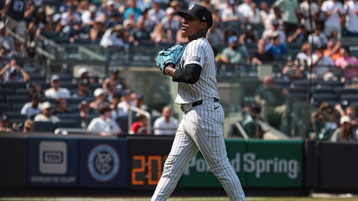 Aug 11, 2024; Bronx, New York, USA; New York Yankees starting pitcher Marcus Stroman (0) walks off the field after being relieved during the sixth inning against the Texas Rangers at Yankee Stadium. 