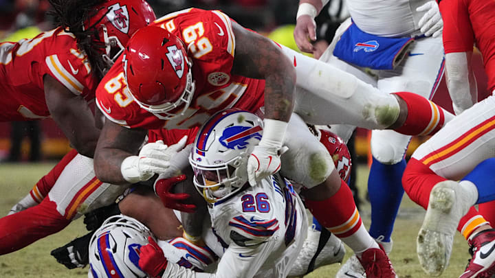 Kansas City Chiefs defensive tackle Mike Pennel Jr. (69) makes a tackle on Buffalo Bills running back Ty Johnson (26) during the second half in the AFC Championship game at GEHA Field at Arrowhead Stadium. 