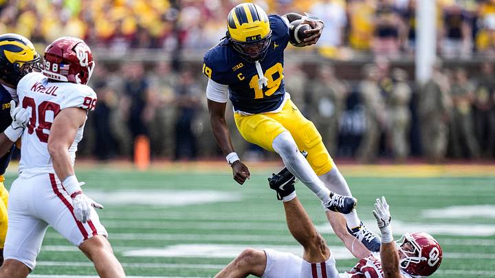 Michigan quarterback Bryce Underwood runs against Oklahoma linebacker Owen Heinecke Michigan quarterback Bryce Underwood runs against Oklahoma linebacker Owen Heinecke