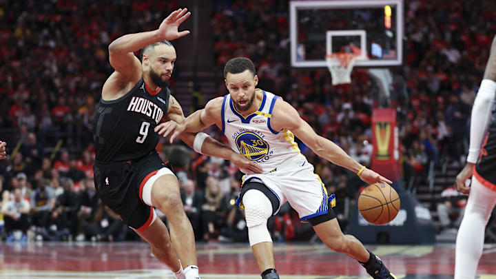 Dec 11, 2024; Houston, Texas, USA; Golden State Warriors guard Stephen Curry (30) drives with the ball as Houston Rockets forward Dillon Brooks (9) defends during the first quarter at Toyota Center. Mandatory Credit: Troy Taormina-Imagn Images
