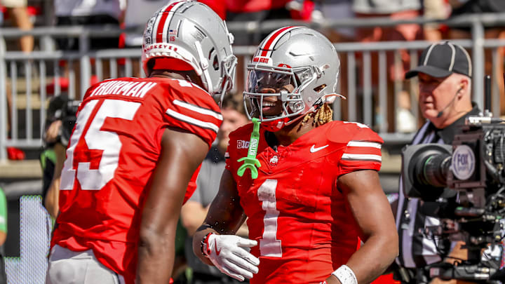 Sep 21, 2024; Columbus, Ohio, USA;  Ohio State Buckeyes running back Quinshon Judkins (1) celebrates his touchdown with tight end Jelani Thurman (15) during the third quarter against the Marshall Thundering Herd at Ohio Stadium. Mandatory Credit: Joseph Maiorana-Imagn Images