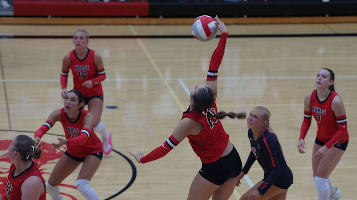 Roland-Story's middle hitter Maddi Lucas (12) hits the ball against Nevada during the second set at Roland-Story High School gym l Sept 18, 2025, in Story City, Iowa. Roland-Story's middle hitter Maddi Lucas (12) hits the ball against Nevada during the second set at Roland-Story High School gym l Sept 18, 2025, in Story City, Iowa.