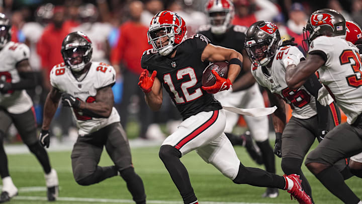 Oct 3, 2024; Atlanta, Georgia, USA; Atlanta Falcons wide receiver KhaDarel Hodge (12) runs for the game winning touchdown against the Tampa Bay Buccaneers in overtime at Mercedes-Benz Stadium. Mandatory Credit: Dale Zanine-Imagn Images